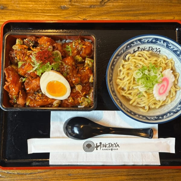 HINODEYA Ramen meal with chicken and egg over rice, and a bowl of ramen noodles.